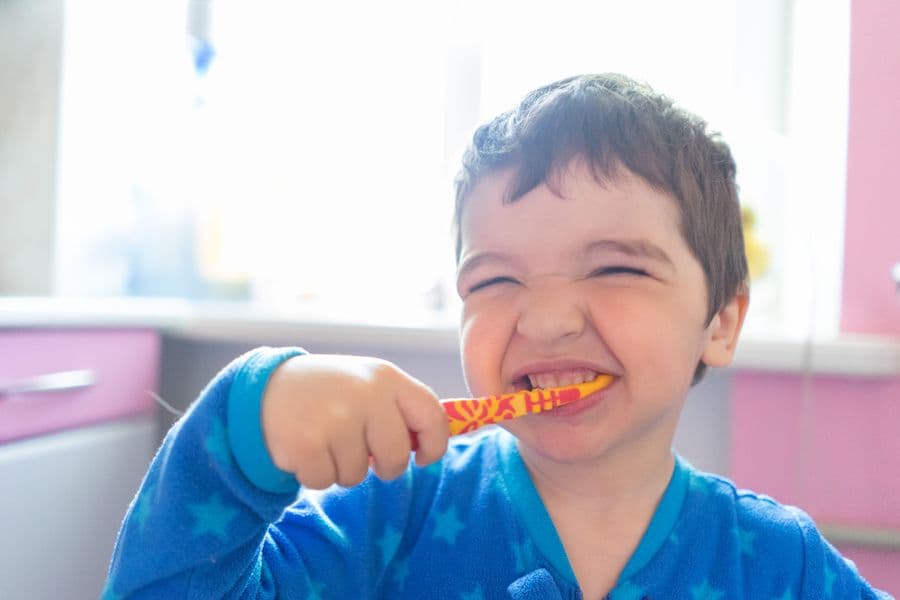 A child brushing their teeth